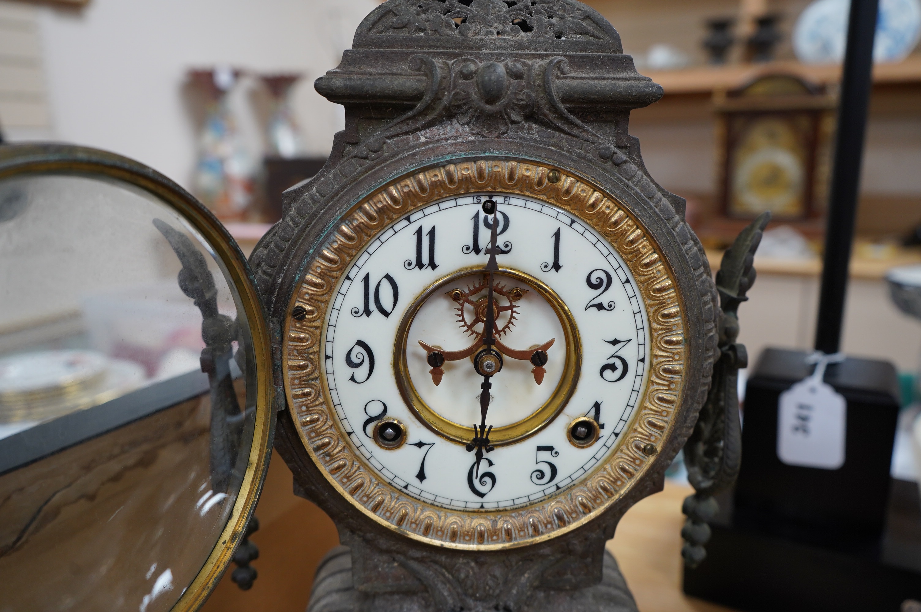 A spelter clock with enamel Arabic dial, 47cm high. Condition - poor to fair, untested